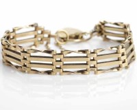 Lot 219 - NINE CARAT GOLD GATE LINK BRACELET with a...