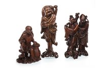 Lot 1040 - A GROUP OF THREE CARVED WOOD FIGURES