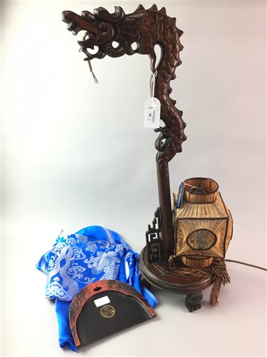 Lot 18 - AN CARVED CHINESE TABLE LAMP WITH A THROW AND TRAY