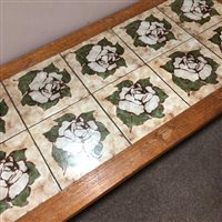 Lot 205 - A TEAK TILE TOPPED COFFEE TABLE