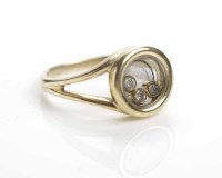 Lot 243 - EIGHTEEN CARAT GOLD HAPPY DIAMOND RING BY...