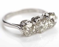 Lot 249 - DIAMOND THREE STONE RING the brilliant cut...