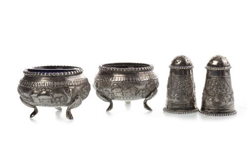 Lot 1044 - A PAIR OF INDIAN SILVER SALT DISHES AND MATCHING PEPPER POTS