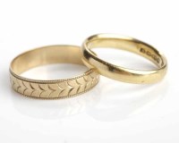 Lot 263 - TWO GOLD WEDDING BANDS one in eighteen carat...