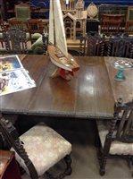 Lot 863 - A STAINED OAK OVAL EXTENDING DINING TABLE