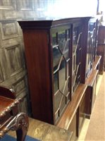 Lot 875 - A SQUAT BREAKFRONT LIBRARY BOOKCASE