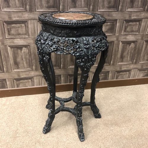 Lot 1057 - A LATE 19TH/EARLY 20TH CENTURY CHINESE CARVED IRONWOOD PEDESTAL TABLE