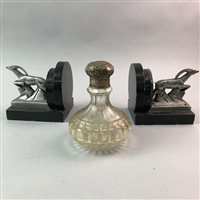 Lot 292 - A SILVER MOUNTED PERFUME BOTTLE AND A PAIR OF ART DECO BOOKENDS