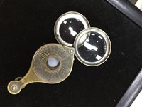 Lot 295 - A SILVER VESTA CASE AND A MAGNIFYING GLASS