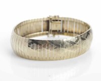 Lot 295 - 1970s GOLD BRACELET formed by narrow...