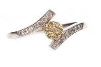 Lot 194 - A YELLOW AND WHITE DIAMOND CLUSTER RING
