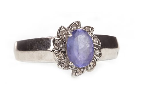 Lot 222 - A PURPLE GEM AND DIAMOND CLUSTER RING