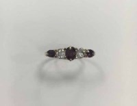 Lot 321 - RUBY AND DIAMOND FIVE STONE RING set with...