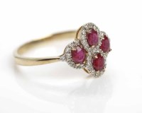 Lot 330 - RUBY AND DIAMOND DRESS RING the quatrefoil...