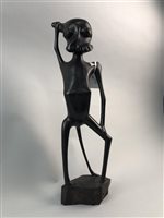 Lot 44 - A STAINED HARDWOOD AFRICAN FIGURAL SCULPTURE