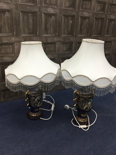 Lot 84 - A PAIR OF TWIN HANDLED LAMP BASES IN THE STYLE OF ROYAL VIENNA