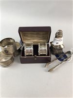 Lot 68 - TWO PAIRS OF SILVER NAPKIN RINGS, A PEPPER POT AND A PAIR OF SUGAR TONGS
