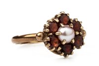 Lot 152 - A RED GEM SET AND PEARL RING