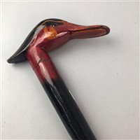 Lot 295 - A JAPANESE LACQUERED WOOD DUCK-HEAD HANDLED WALKING STICK