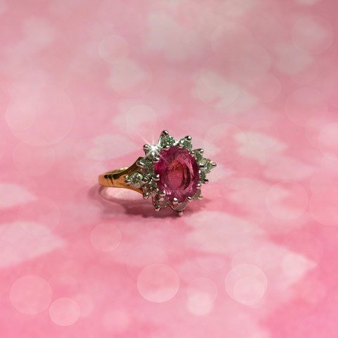 Lot 127 - A CERTIFICATED PINK SAPPHIRE AND DIAMOND CLUSTER RING