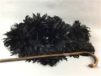 Lot 340 - AN EDWARDIAN WALKING CANE AND A FEATHERED BOA