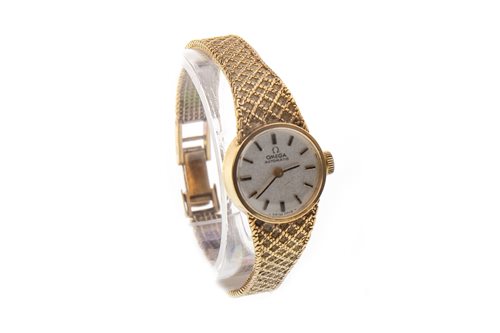 Lot 786 - A LADY'S OMEGA AUTOMATIC GOLD WATCH
