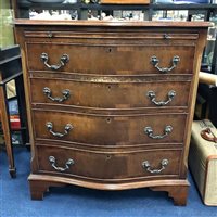Lot 382 - A MAHOGANY SERPENTINE CHEST OF DRAWERS