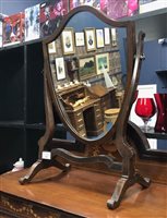 Lot 383 - A MAHOGANY SHIELD SHAPED DRESSING MIRROR