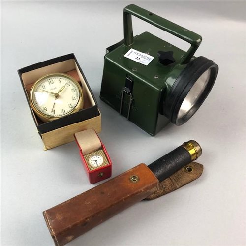 Lot 33 - A BRASS POCKET TELESCOPE, A MILITARY TORCH AND TWO SMALL CLOCKS