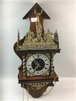 Lot 22 - A REPRODUCTION BRASS MOUNTED WOOD WALL CLOCK AND AN OAK BAROMETER