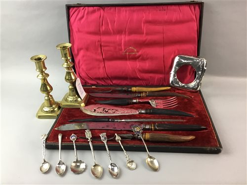 Lot 137 - A SET OF SILVER COLLARED CARVING CUTLERY, CANDLESTICKS, SPOONS AND A CLOCK MOUNT