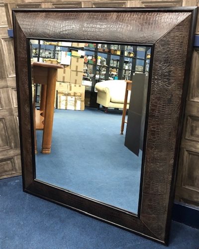 Lot 241 - A LEATHER FRAMED WALL MIRROR