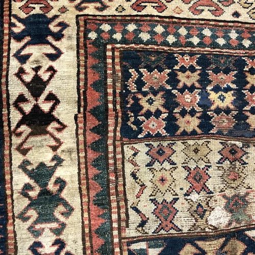 Lot 1177 - A MIDDLE EASTERN FRINGED RUG