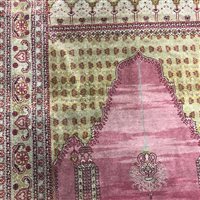 Lot 253 - AN EASTERN FRINGED AND MULTI BORDERED PRAYER RUG