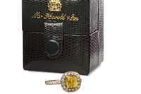 Lot 143 - A YELLOW SAPPHIRE AND DIAMOND RING