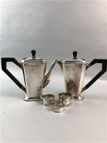 Lot 318 - A LOT OF THREE SILVER CIRCULAR NAPKIN RINGS AND A SILVER PLATED CAFE AU LAIT
