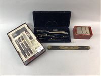 Lot 410 - A LOT OF TWO DRAUGHTSMAN SETS, A SPIRIT LEVEL AND A MONEY BANK