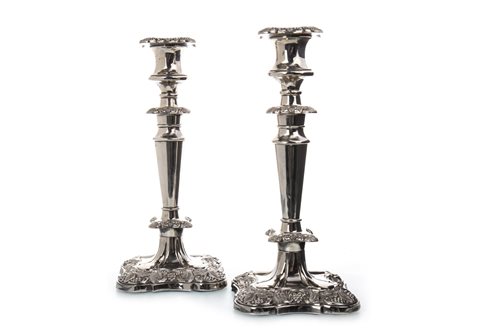 Lot 878 - A PAIR OF SILVER PLATED CANDLESTICKS OF EDWARDIAN DESIGN