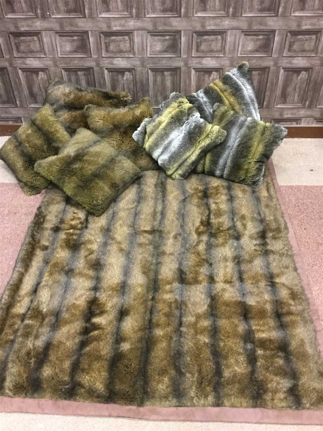 Lot 1849 - A FAUX FUR RUG AND CUSHIONS