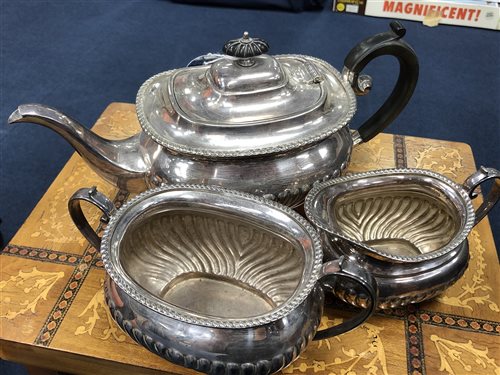 Lot 45 - A SILVER PLATED THREE PIECE TEA SERVICE, PAIR OF SALT DISHES AND BRASS CANDLESTICKS