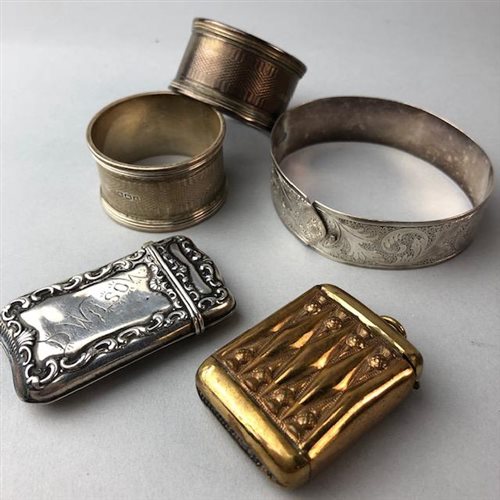 Lot 4 - A PAIR OF SILVER NAPKIN RINGS, TWO VESTA CASES AND A SILVER BANGLE