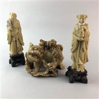 Lot 174 - A CARVED SOAPSTONE GROUP OF LIONS AND A PAIR OF FIGURES