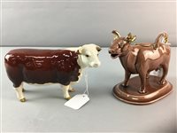 Lot 326 - A BESWICK CH OF CHAMPIONS MODEL AND A CERAMIC COW CREAMER