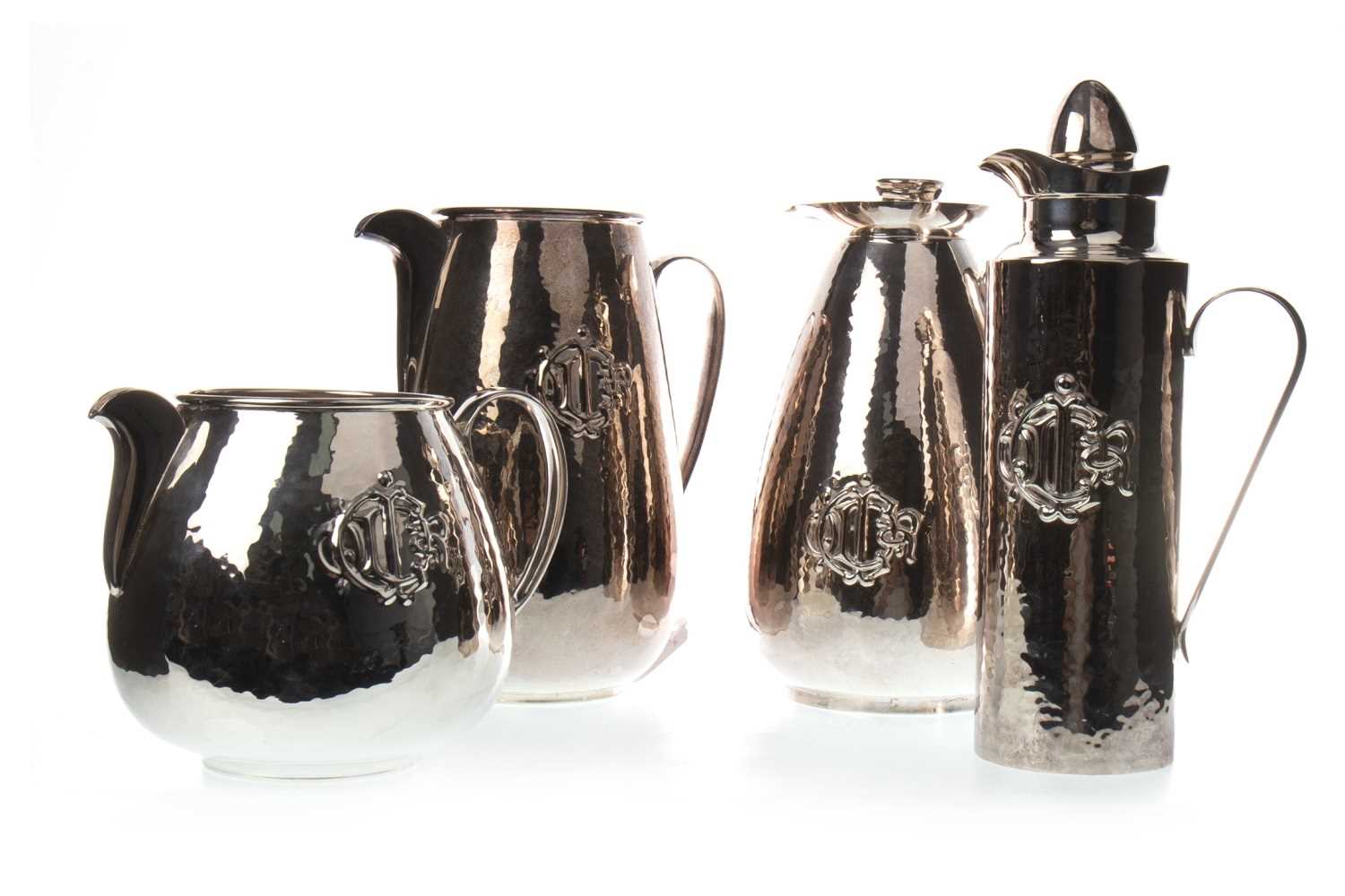 Lot 1825 - A LOT OF TWO SILVER PLATED WATER JUGS AND TWO INSULATED JUGS BY CHRISTIAN DIOR