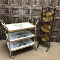 Lot 353 - A TUBULAR METAL TEA TROLLEY AND A POKERWORK CAKESTAND