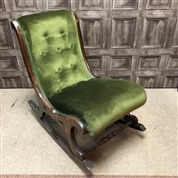 Lot 371 - A STAINED WOOD UPHOLSTERED ROCKING CHAIR