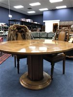 Lot 372 - A CHERRYWOOD CIRCULAR DINING TABLE