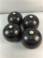 Lot 385 - A SET OF FOUR LAWN BOWLS