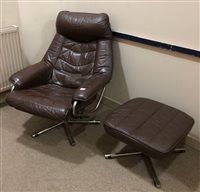 Lot 407 - A BROWN LEATHER ARMCHAIR AND STOOL