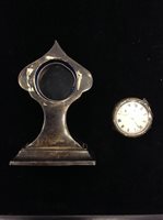 Lot 887 - A GEORGE V SILVER TRAVEL CLOCK AND ANOTHER